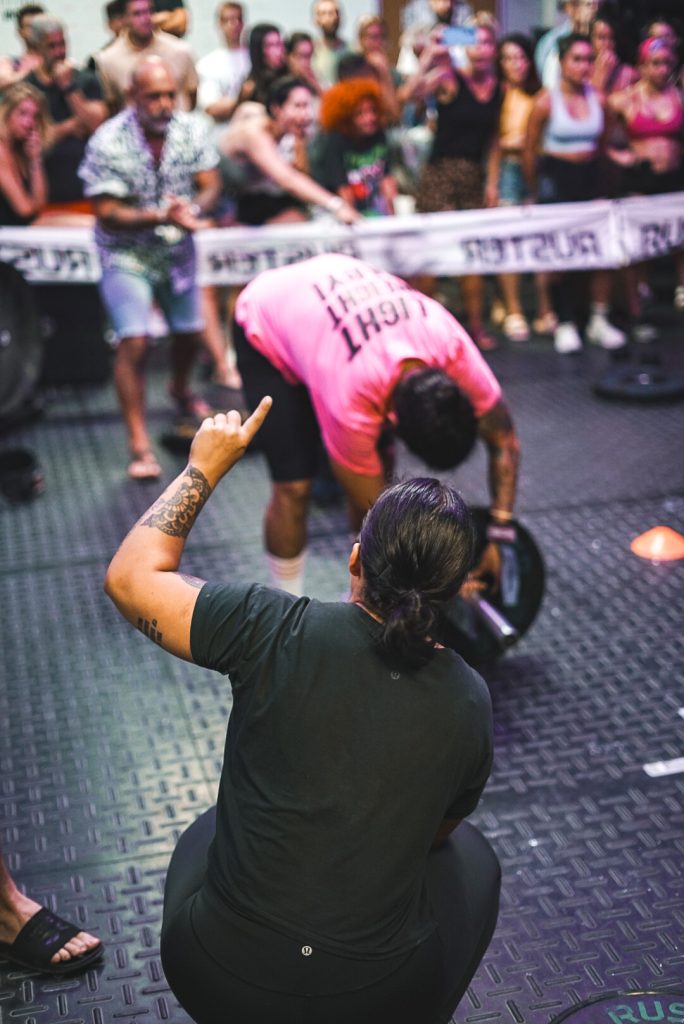 CrossFit Puerto Banús coach guiding an athlete on the competition floor